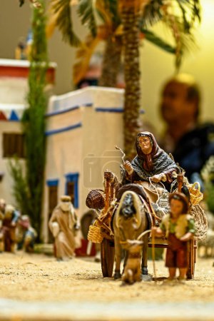 Photo for Old woman riding a cart in a portal of Bethlehem - Royalty Free Image