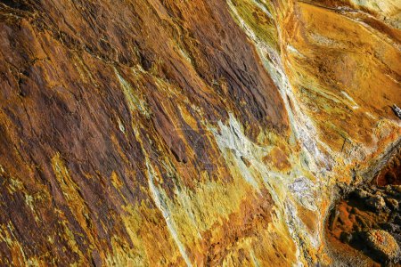 Vivid mineral deposits and rock formations along the banks of the Rio Tinto in Huelva, Spain
