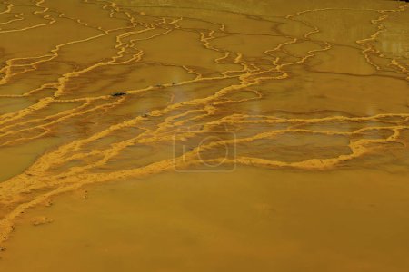 Aerial shot of the unique yellow and orange stratified banks of Rio Tinto in Huelva, Spain