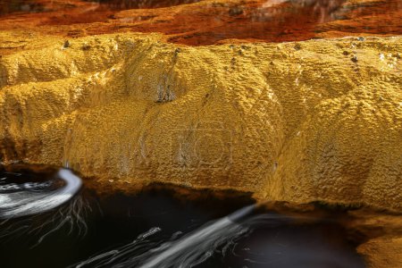 Vivid details of the iron-rich sediment and microbial mats along the banks of Rio Tinto.