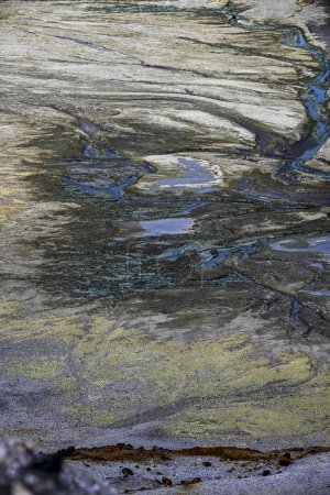 The Rio Tinto's landscape presents a tapestry of mineral traces with acidic streams carving through the terrain