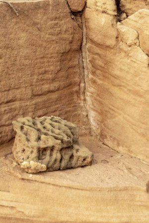 Close-up of a weathered sandstone corner featuring distinct erosion layers and natural textures. Ideal for geological studies and nature backgrounds.
