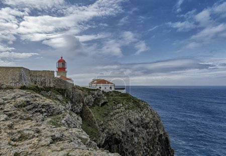 The iconic Saint Vincent Lighthouse perched on the rocky cliffs of Cabo de Sao Vicente in Portugal.