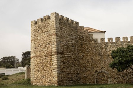 View of the Castle of the Governors in Lagos, Portugal, showcasing its historic stone walls and battlements. This ancient fortification is a notable landmark in the region.