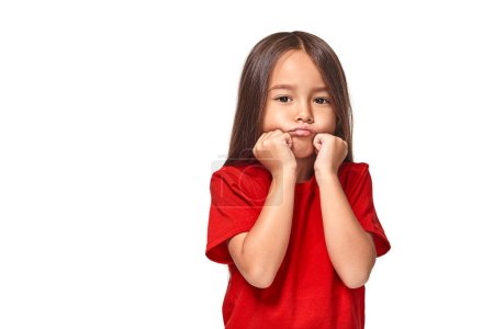 Photo for Kid unhappy looks strictly. Girl folded arms on chest looks serious. Sensitive girl not want to talk. Child offended keep silence. - Royalty Free Image