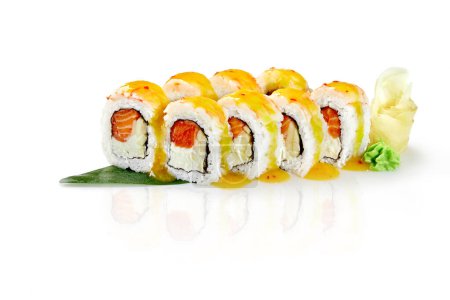 Photo for Delicate rolls with cream cheese, salmon and apple topped with tiger prawn seasoned with mango chili sauce served with spicy wasabi and gari on bamboo leaf, isolated on white background. Japanese food - Royalty Free Image