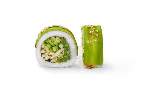 Vegetarian avocado sushi roll with light vegetable filling of hiyashi wakame, napa cabbage and cucumber drizzled with unagi sauce and sesame seeds, isolated on white background