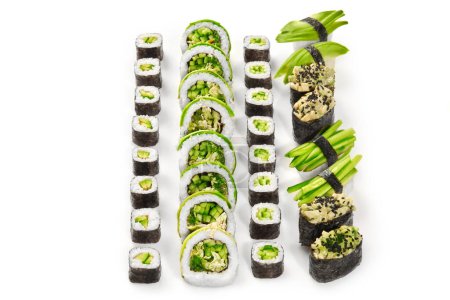 Collection of vegetarian sushi rolls, featuring makizushi, uramaki, nigiri and gunkan-maki with avocado, cucumbers, hiyashi wakame and green lettuce topped with sesame, arranged on white background