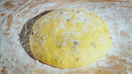 Photo for The dough is rising, dough with raisins for homemade baking. - Royalty Free Image