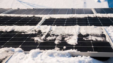 Photo for Snow melts on solar panels with the arrival of spring. - Royalty Free Image