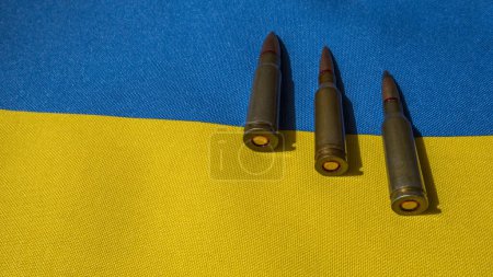Photo for Several bullets are on the Ukrainian flag - Royalty Free Image