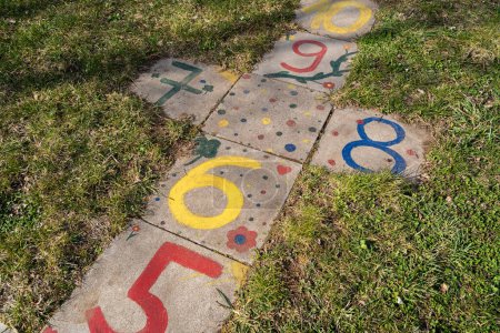 Photo for Hopscotch game for children painted on the floor with colorful numbers - Royalty Free Image