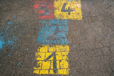 Photo for Hopscotch game for children on the floor with colorful numbers - Royalty Free Image