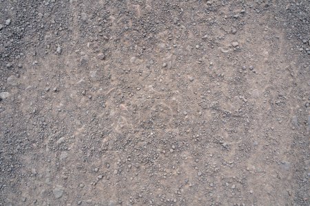 Background with gravel stones on a gravel road