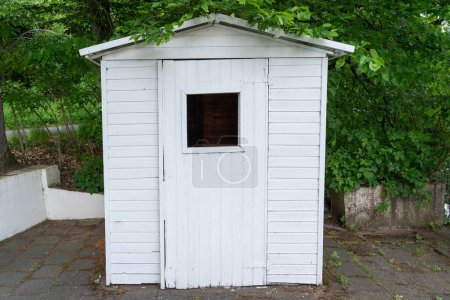 Small white shed in the park