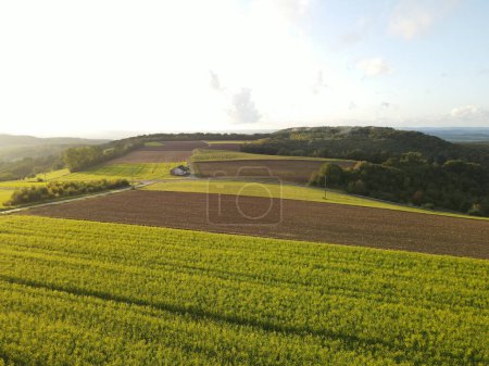 Aerial view of a countryside with farm fields and trees