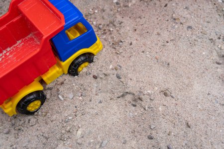 Children toy truck in the sandbox