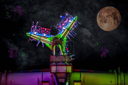 Moonlit Night at Colorful Spinning Amusement Ride