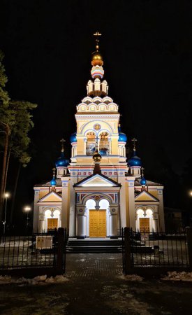 Photo for An Orthodox church is illuminated by floodlights at night in the Latvian city of Jurmala in January 2023. - Royalty Free Image