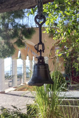 Bell in the Church of St. Patapios in the monastery on a sunny, winter day (Loutraki, Greece)