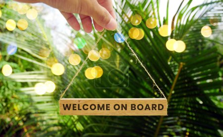 Photo for WELCOME ON BOARD written on a wooden block with fresh nature background, conceptual copyspace. - Royalty Free Image