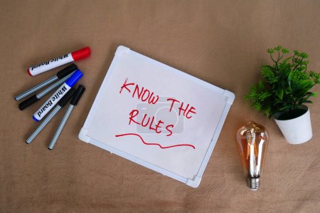 Photo for KNOW THE RULES text, handwritten as a note on a white board. - Royalty Free Image