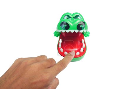 Photo for Crocodile bites plastic toy isolated - Royalty Free Image