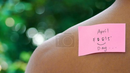 Photo for Note with text Happy Fools Day stuck to man's back - Royalty Free Image