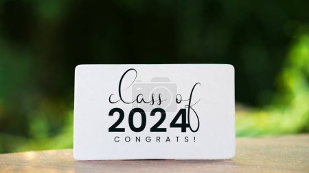 Photo for Class of 2024 card with bokeh background. Senior 2024. congratulations graduates. - Royalty Free Image