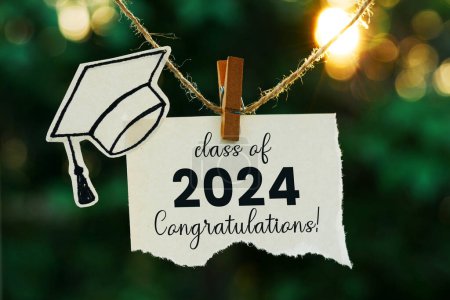  class of 2024 on a note paper hanging on rope with bokeh background