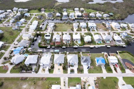 Photo for Hurricane Ian destroyed homes in Florida residential area on golf course. Natural disaster and its consequences - Royalty Free Image