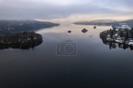 Photo for Lake Windermere,  Lake District in England in winter with snow on the ground. Aerial drone above view. - Royalty Free Image
