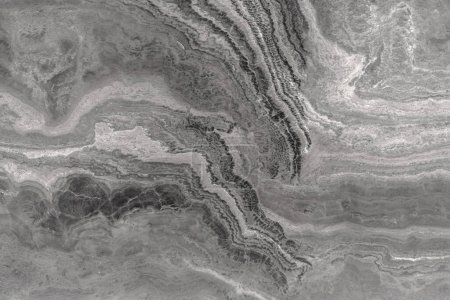 Téléchargez les photos : Pierre grise avec une texture ondulée unique, structure granulaire poreuse de roche naturelle. - en image libre de droit