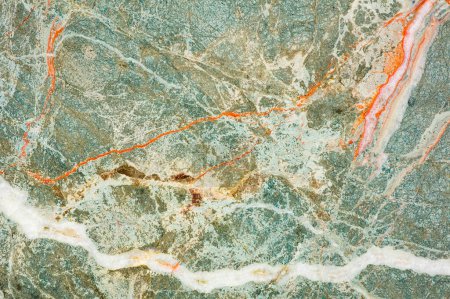 A detailed close-up of turquoise marble with intricate white and orange veining that highlights the natural beauty and complexity of the stones' patterns.