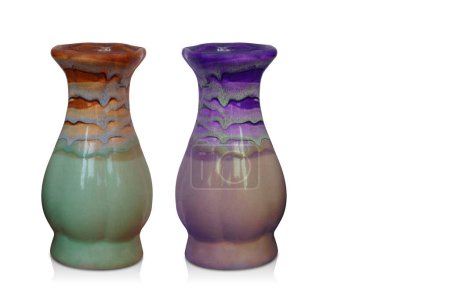 Foto de Two ceramic vase, green and brown and violetand cream color on white background, object, retro, vintage, decor, banner, copy space - Imagen libre de derechos