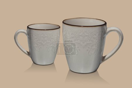 Photo for Two white and brown ceramic cups on brown background, object, decor, fashion, decoration, kitchen, antique, copy space - Royalty Free Image