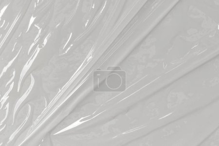 Téléchargez les photos : Sac en plastique cellophane transparent sur fond blanc. Film plastique blanc envelopper fond texture. Texture de sac en plastique blanc - en image libre de droit