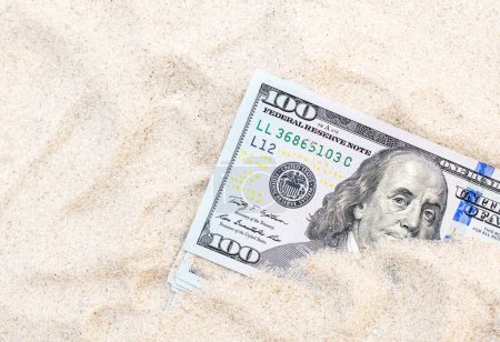 Photo for Money hidden in the sand. - Royalty Free Image