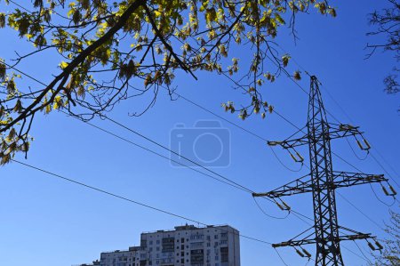 Photo for A transmission tower on the background of a residential building - Royalty Free Image
