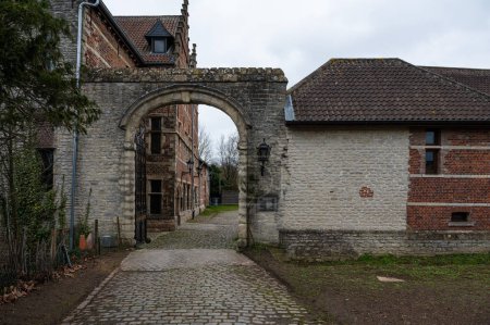 Photo for Grimbergen, Flemish Brabant Region -  Belgium - Feb. 19 2023 - Entrance of the rustic Charleroy farm with old brick stone walls and a gate - Royalty Free Image