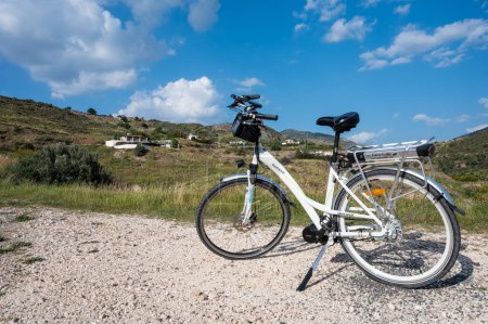 Photo for Peyia, Cyprus, March 27, 2023 - Electric bicycle standing on a rough outdoor location - Royalty Free Image