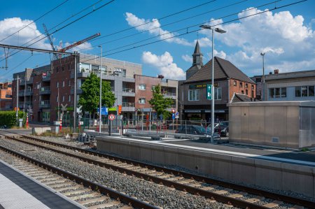 Photo for Buggenhout, East Flemish Region, Belgium, June 11, 2023 - Platform and railway track of the Buggenhout - Royalty Free Image