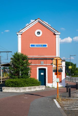 Photo for Opwijk, Flemish Brabant, Belgium, June 11, 2023 - Orange building of the Opwijk local railway station - Royalty Free Image