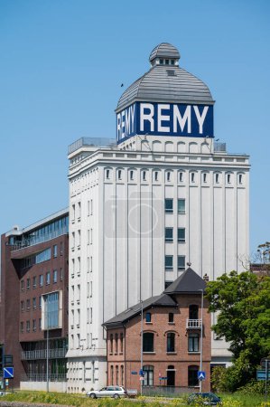 Photo for Wijgmaal, Leuven, Belgium - May 29, 2023 - The industrial plant of the Remy company, producing rice starch, reflecting in the canal - Royalty Free Image
