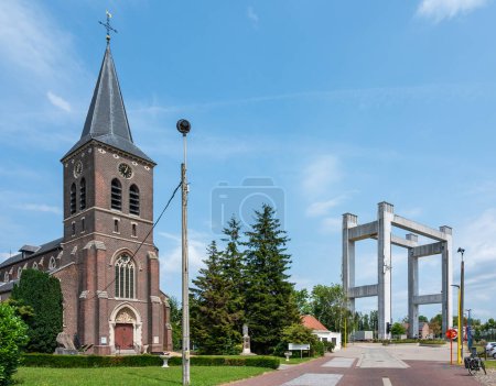 Photo for Grimbergen, Flemish Brabant, Belgium, June 30, 2023 - Catholic church of the village against blue sky - Royalty Free Image
