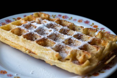 Photo for Close up of fresh home made Brussels Waffles covered with icing sugar, Brussels, Belgium - Royalty Free Image