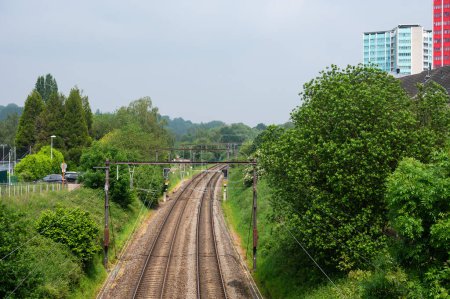 Ganshoren, Brussels Capital Region, Belgium, May 18, 2024 - Bending double tracks of the local railways trhough the park