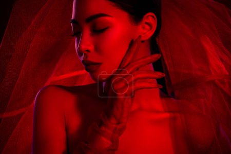 Photo for Close up photo of magnificent chic lady in bridal veil touch gentle cheek isolated on bright ruby color background. - Royalty Free Image
