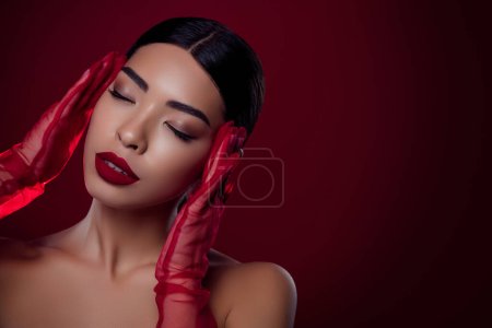 Photo for Close up photo of magnificent lady touching her face with red trend gloves isolated on ruby color background. - Royalty Free Image