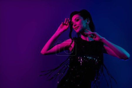Photo for Excited woman dancing disco party 80s 90s theme clothes dress purple magenta pink blue violet neon color background. - Royalty Free Image